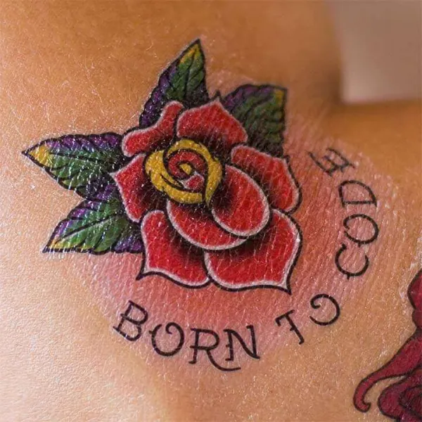 Rose tattoo reading Born to Code