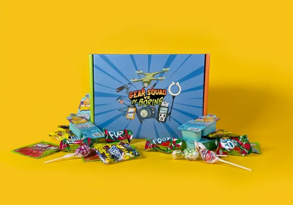 Gear Squad box surrounded by candy on a yellow backdrop